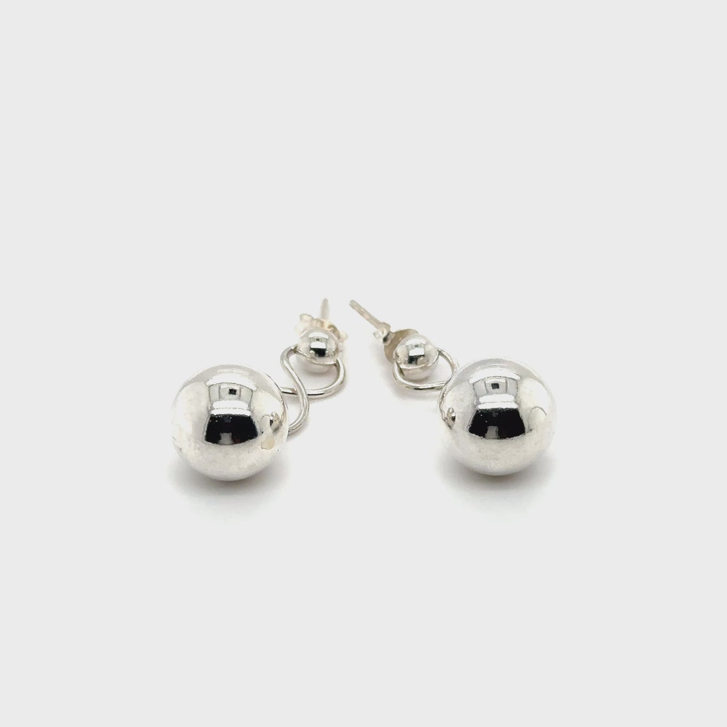 
                  
                    Load and play video in Gallery viewer, Dangly Silver Ball Earring
                  
                