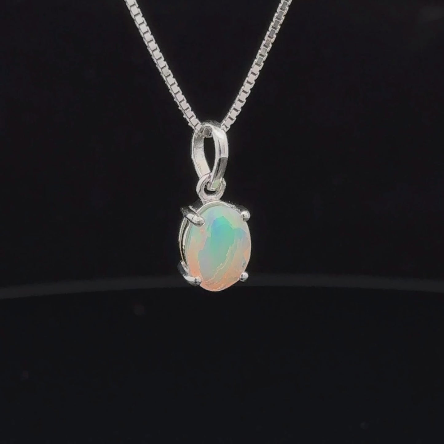 
                  
                    Load and play video in Gallery viewer, Tiny Oval Pronged Ethiopian Opal Pendant
                  
                