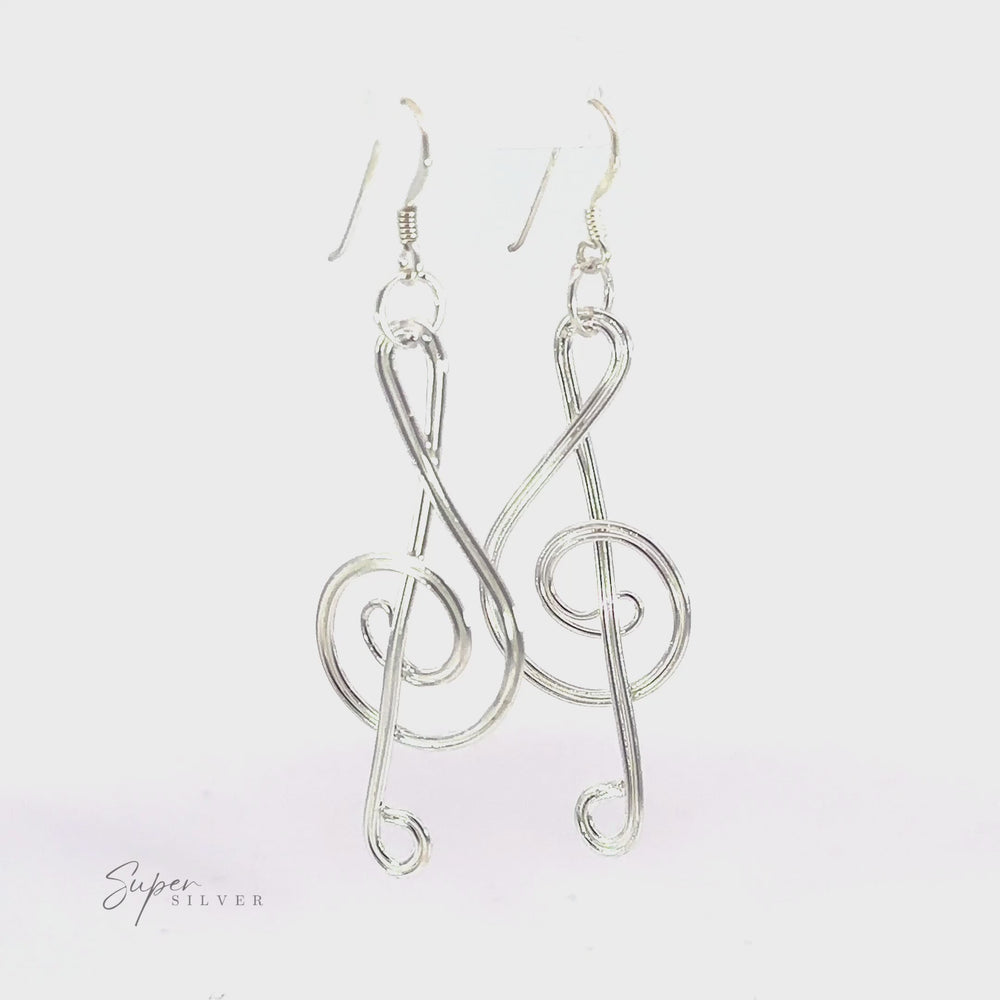 
                  
                    Load and play video in Gallery viewer, Wire Treble Clef Earrings
                  
                