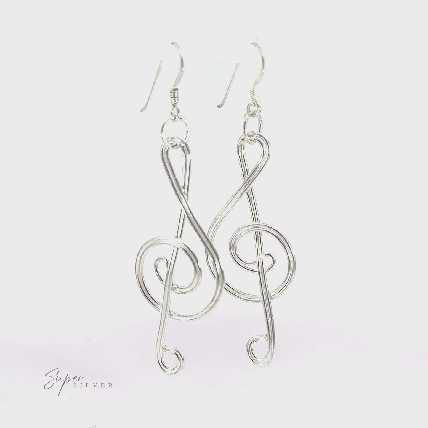 
                  
                    Load and play video in Gallery viewer, Wire Treble Clef Earrings
                  
                