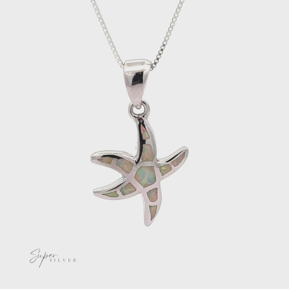 
                  
                    Load and play video in Gallery viewer, Lab-Created Opal Sea Star Pendant
                  
                