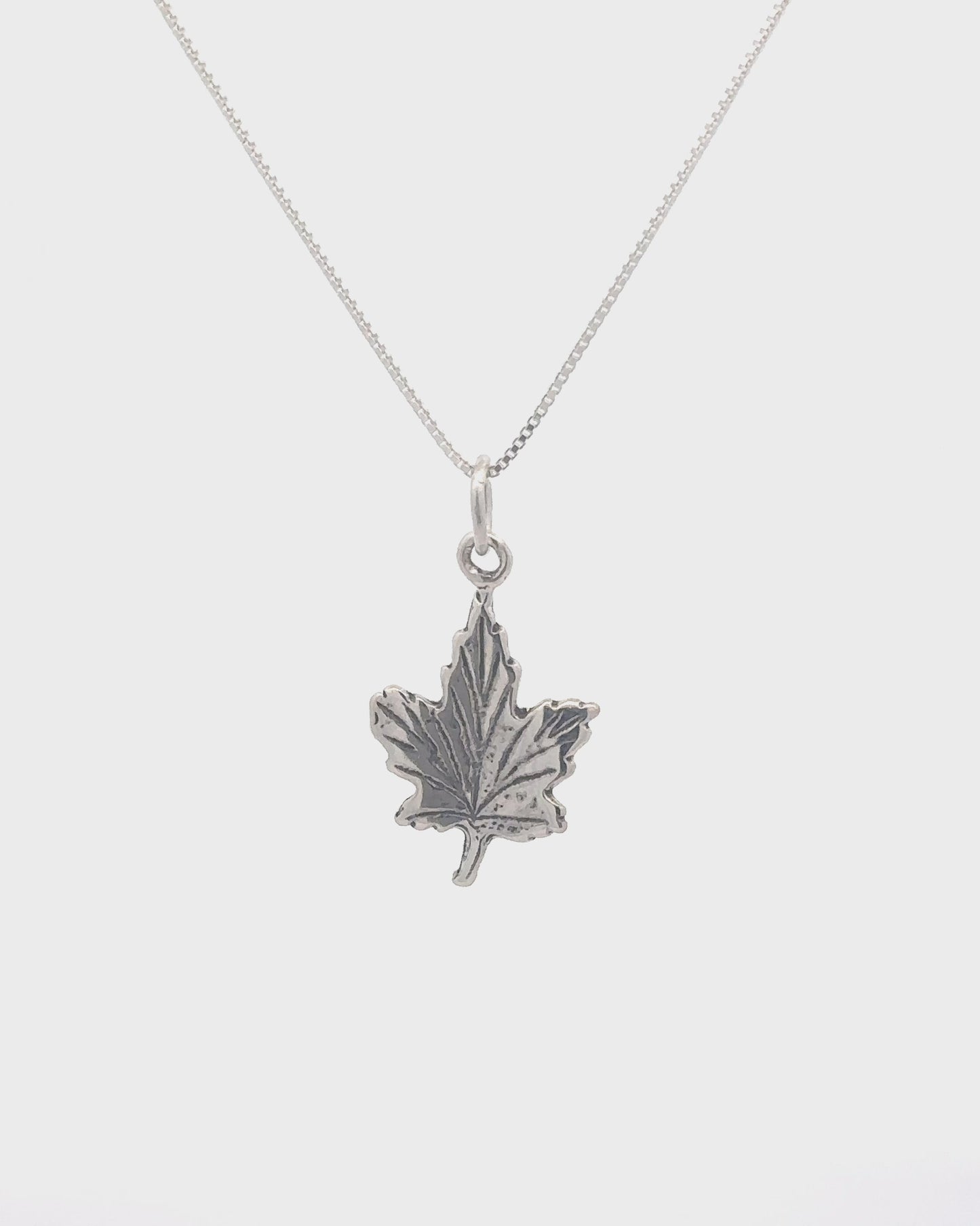 
                  
                    Load and play video in Gallery viewer, Tiny Maple Leaf Charm
                  
                