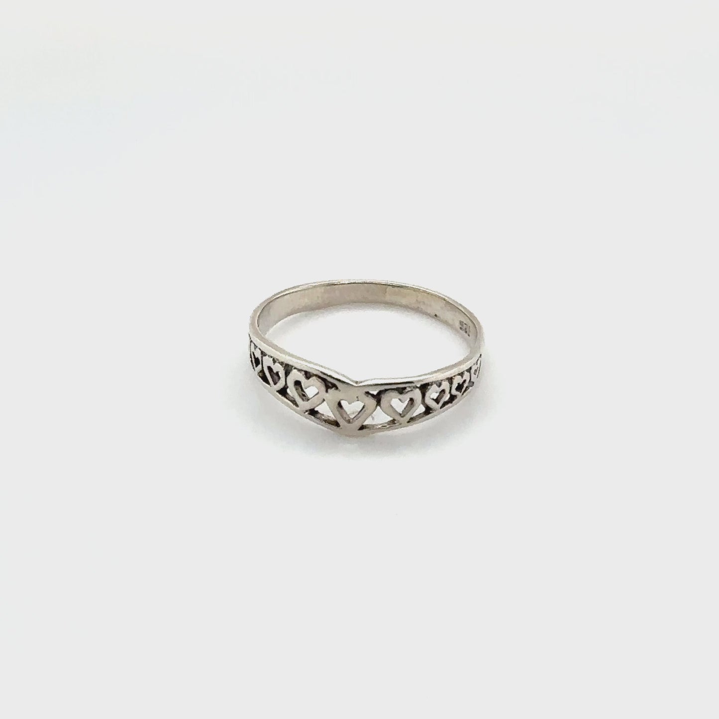 
                  
                    Load and play video in Gallery viewer, Chevron Shaped Ring Lined with Hearts
                  
                
