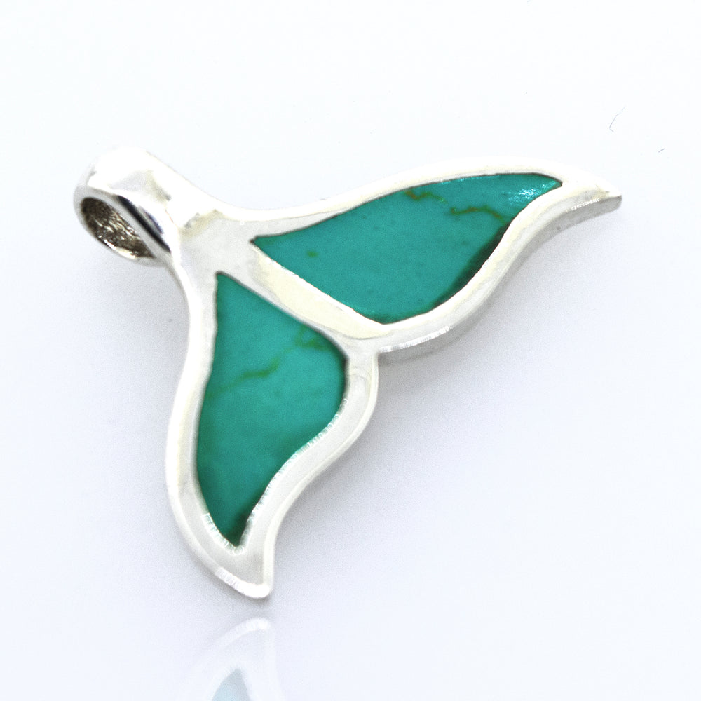 
                  
                    This Inlay Whale Tail Pendant from Super Silver features an exquisite turquoise stone.
                  
                