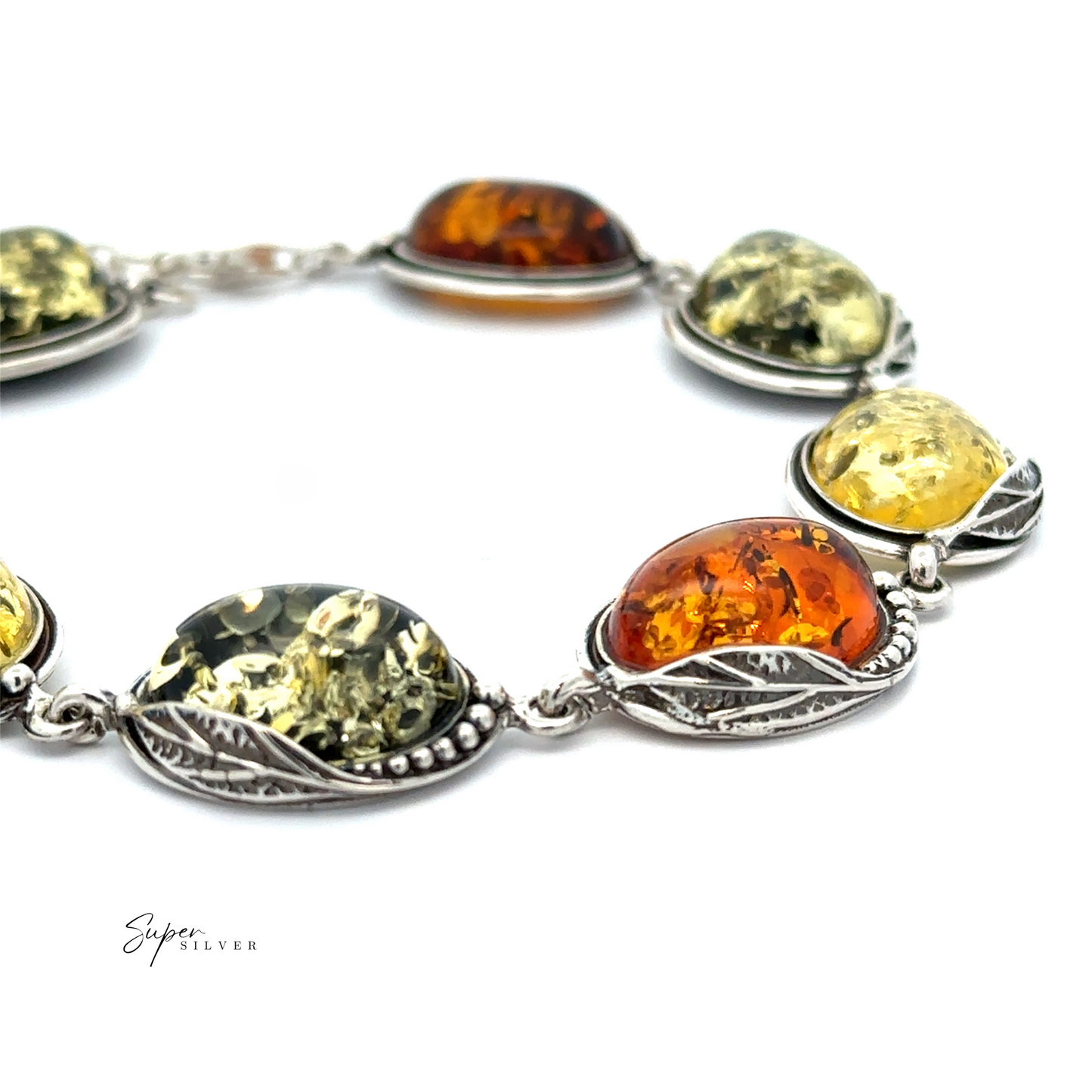 
                  
                    The Oval Amber Link Bracelet With Leaf Detail boasts an enchanting vintage charm, showcasing alternating yellow and orange oval gemstones reminiscent of cognac amber stones, each elegantly encased in a detailed silver setting.
                  
                