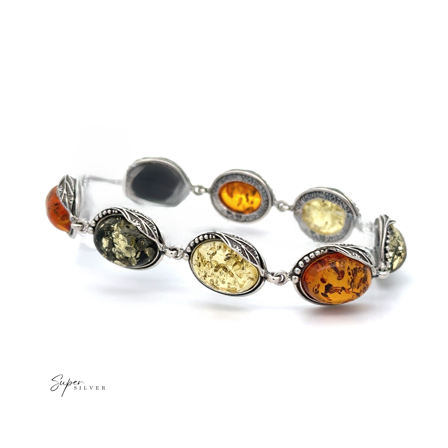 
                  
                    The Oval Amber Link Bracelet With Leaf Detail showcases timeless elegance and vintage charm with its silver design featuring oval Baltic amber stones in various shades, accented by intricate leaf motifs around each stone.
                  
                