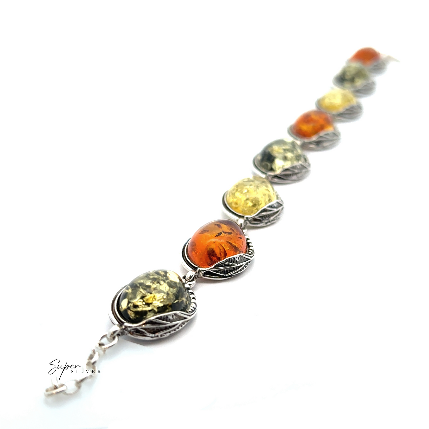 
                  
                    Introducing the Oval Amber Link Bracelet With Leaf Detail: a stunning silver piece showcasing seven Baltic amber stones in alternating hues of orange and yellow, each encircled by an intricate leaf pattern, offering timeless elegance and vintage charm.
                  
                