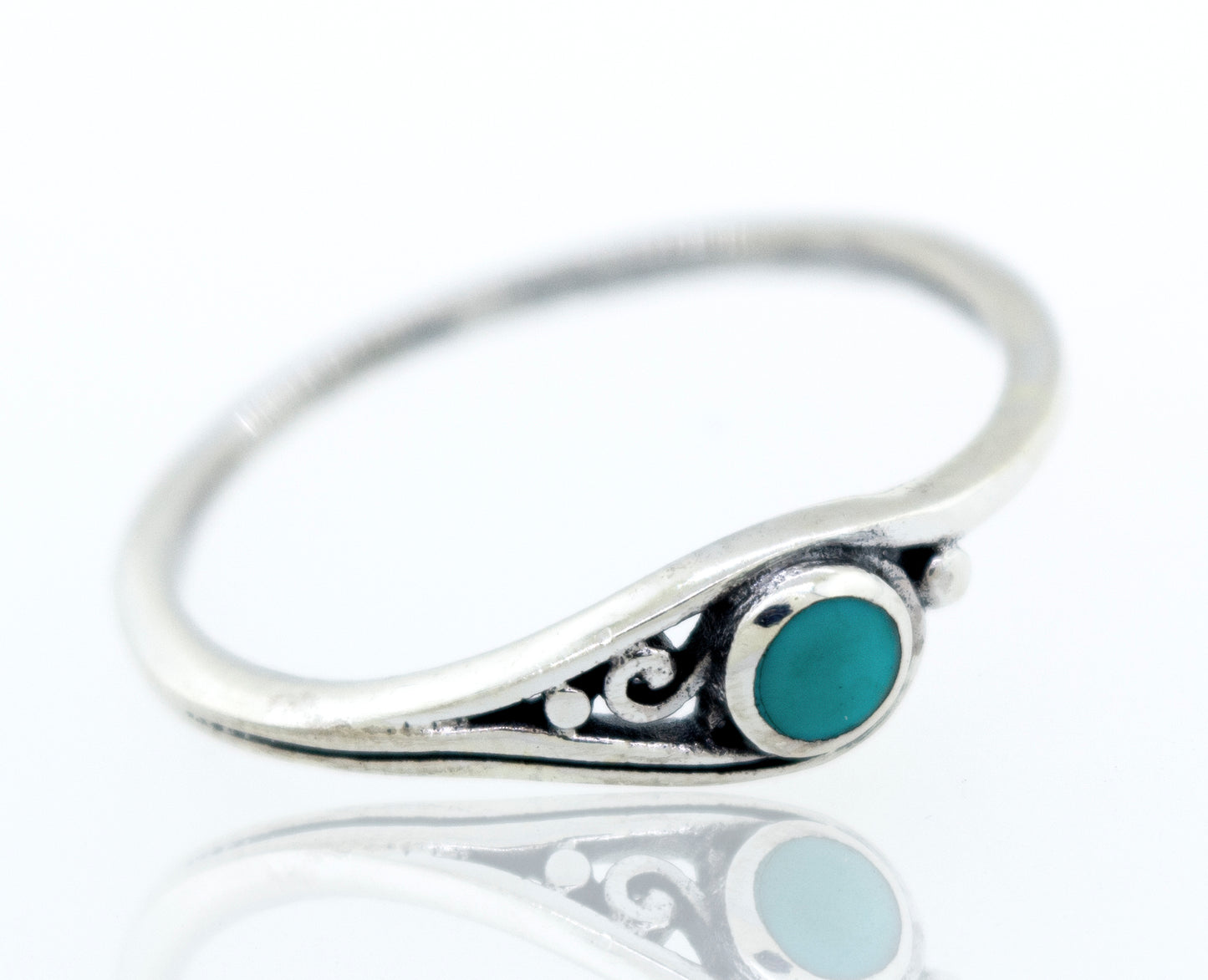 
                  
                    A delicate inlay stone ring with small swirl design made of sterling silver.
                  
                