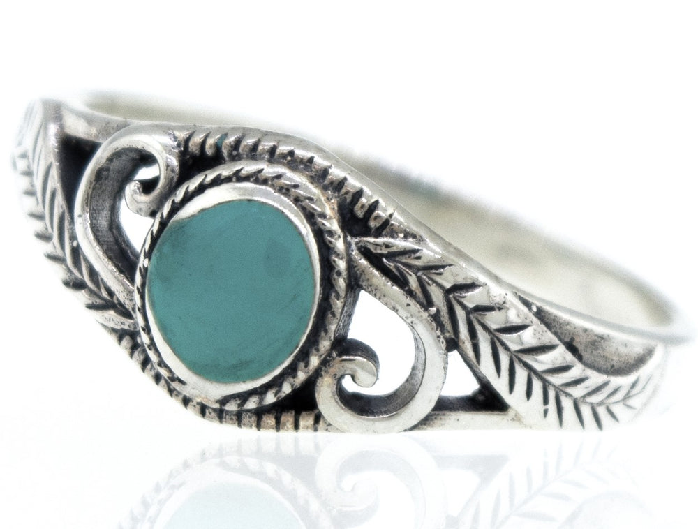 A sterling silver Turquoise Ring with Leaves and Swirls.