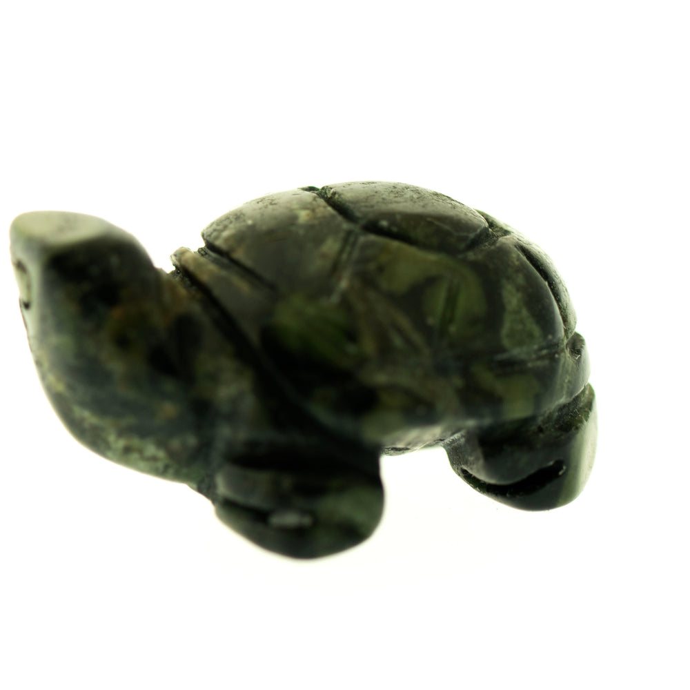 
                  
                    A small, dark green, carved turtle gemstone figure stands against a plain white background.
                  
                