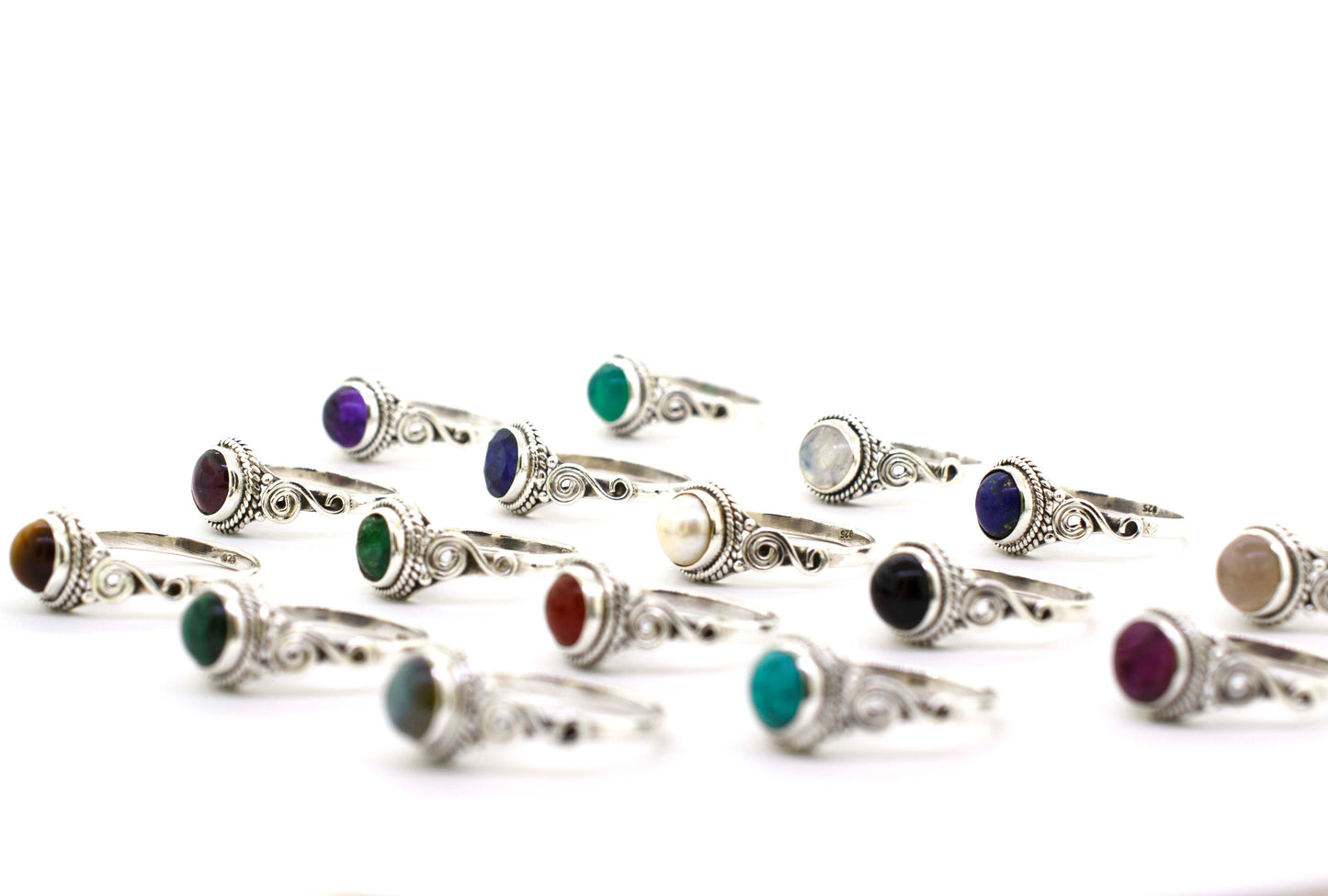 A group of Gemstone Circle Rings With Rope Border And Swirl Design, including cabochon stones.