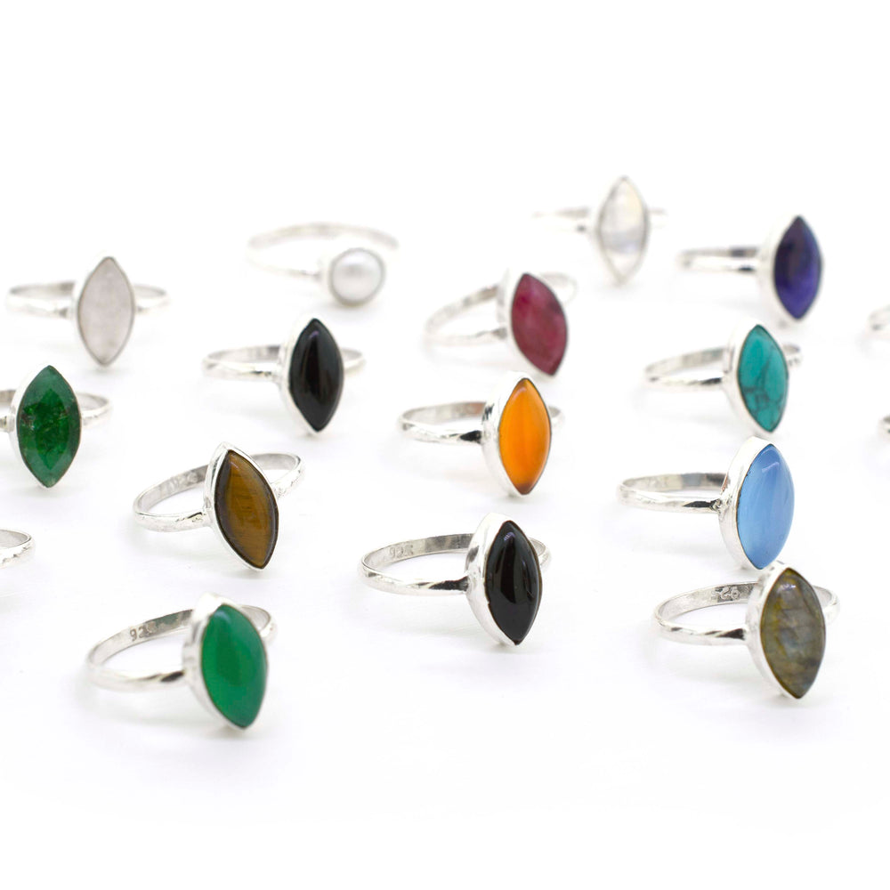 A group of Simple Marquise Shaped Gemstone Rings on a white background.