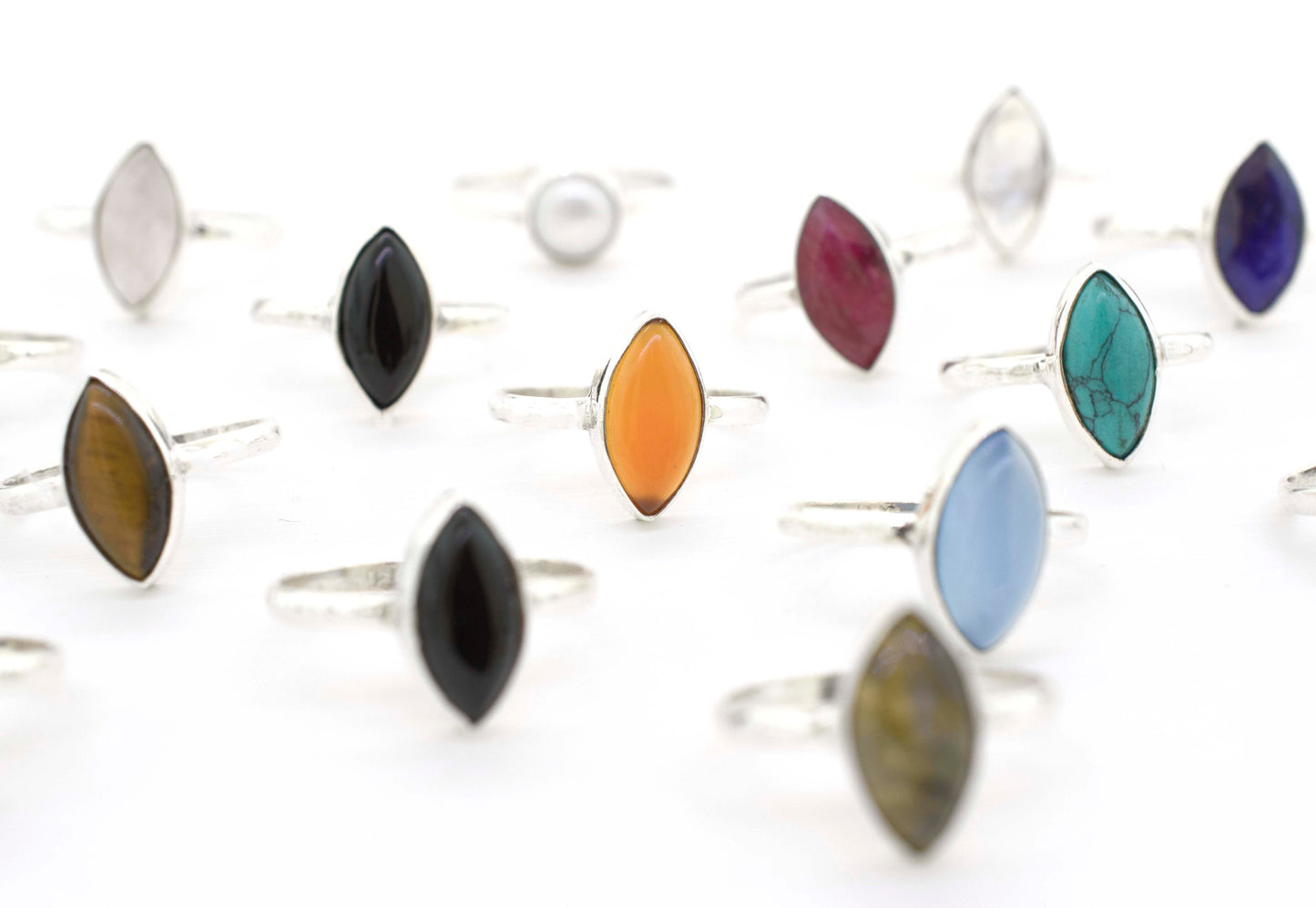 A group of Simple Marquise Shaped Gemstone Rings with different colored stones.