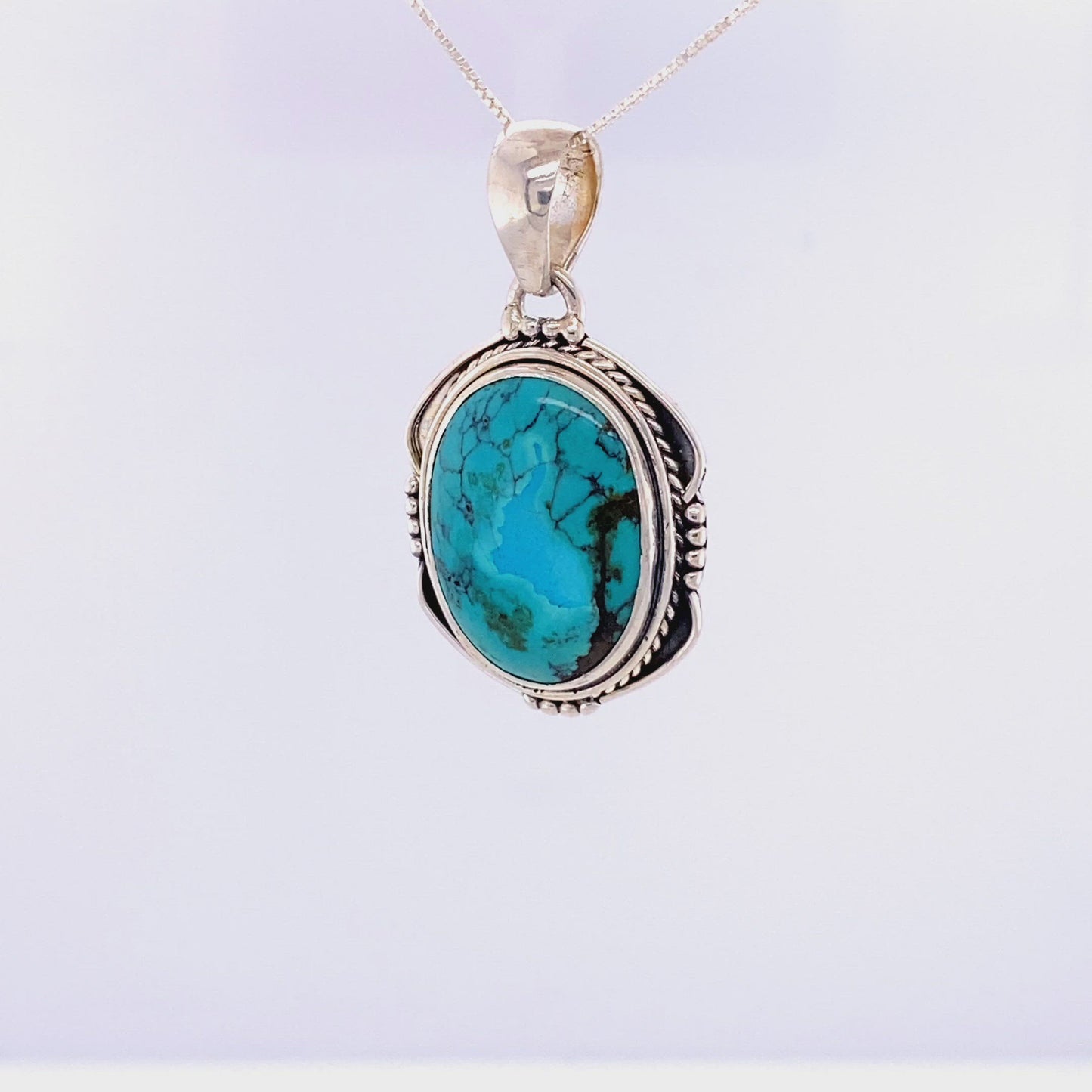 
                  
                    Load and play video in Gallery viewer, Natural Turquoise Pendant with an Oval Shield Setting
                  
                