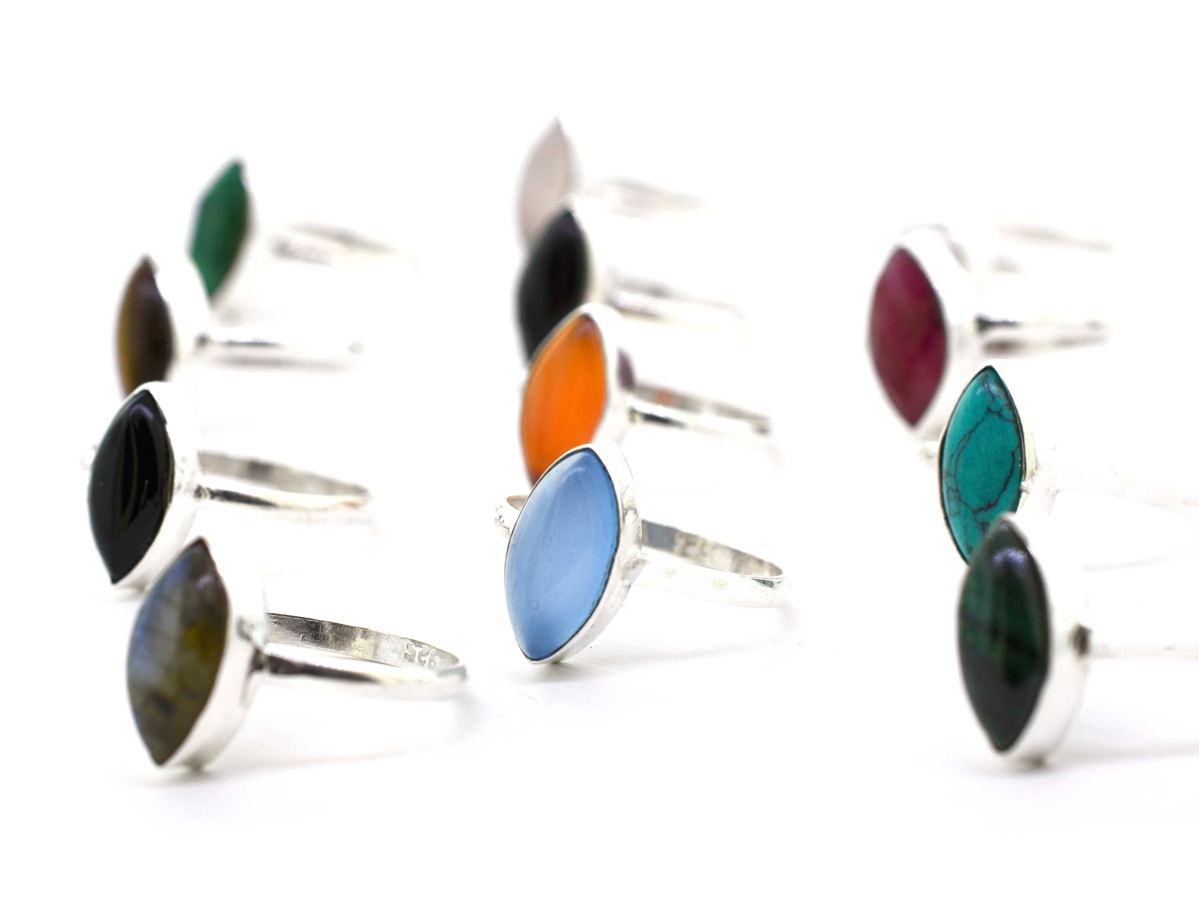 A group of colorful Simple Marquise Shaped Gemstone Rings on a white background.