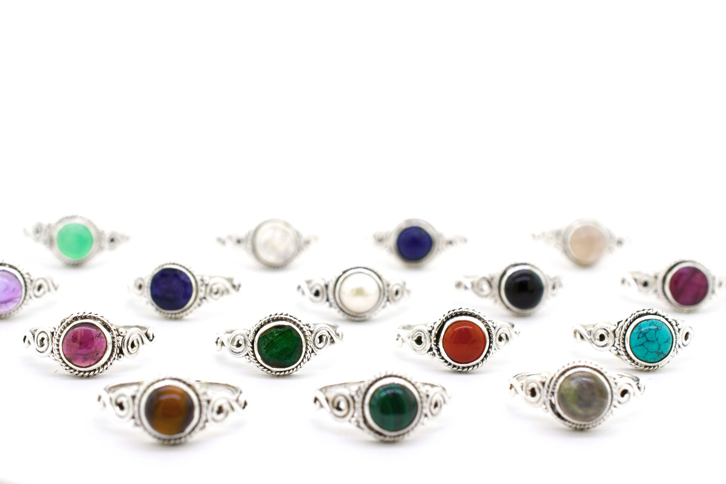 
                  
                    A group of Gemstone Circle Rings With Rope Border And Swirl Design on a sterling silver background.
                  
                