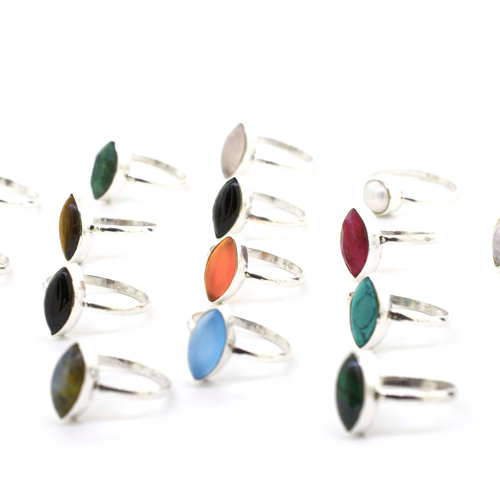 
                  
                    A boho-inspired collection of Simple Marquise Shaped Gemstone Rings adorned with cabochon stones in various vibrant colors.
                  
                