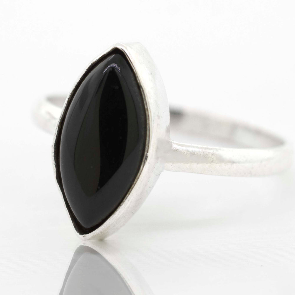 
                  
                    A sterling silver ring with a Simple Marquise Shaped Gemstone Ring.
                  
                