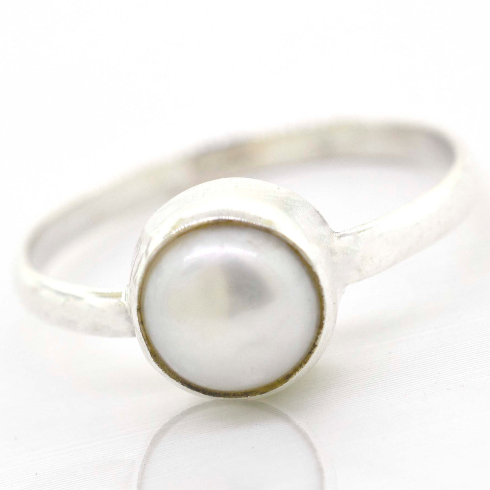 
                  
                    A boho-inspired Simple Marquise Shaped Gemstone Ring made of sterling silver, set elegantly on a crisp white surface.
                  
                
