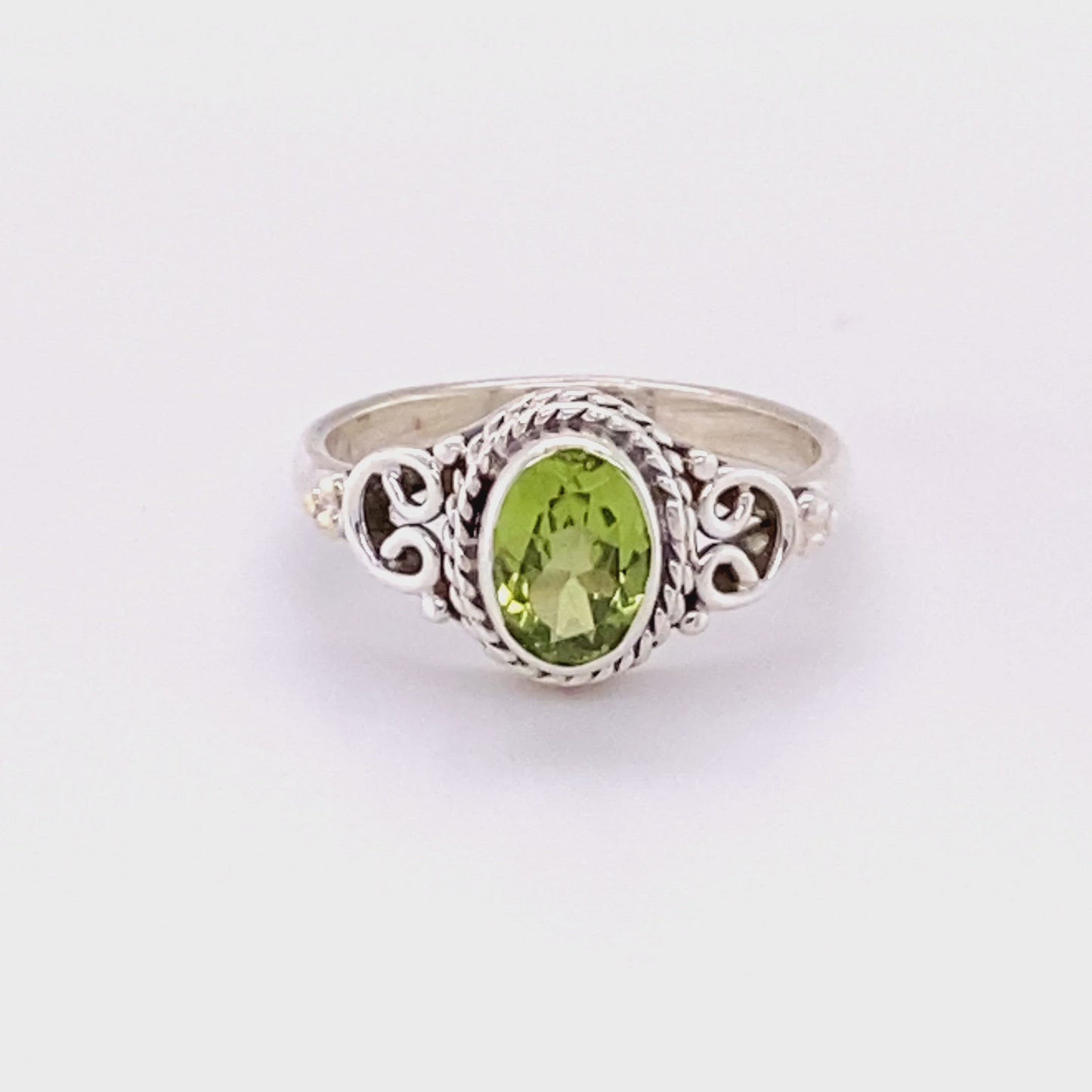 
                  
                    Load and play video in Gallery viewer, Oval Peridot Ring with Rope and Swirl Border
                  
                