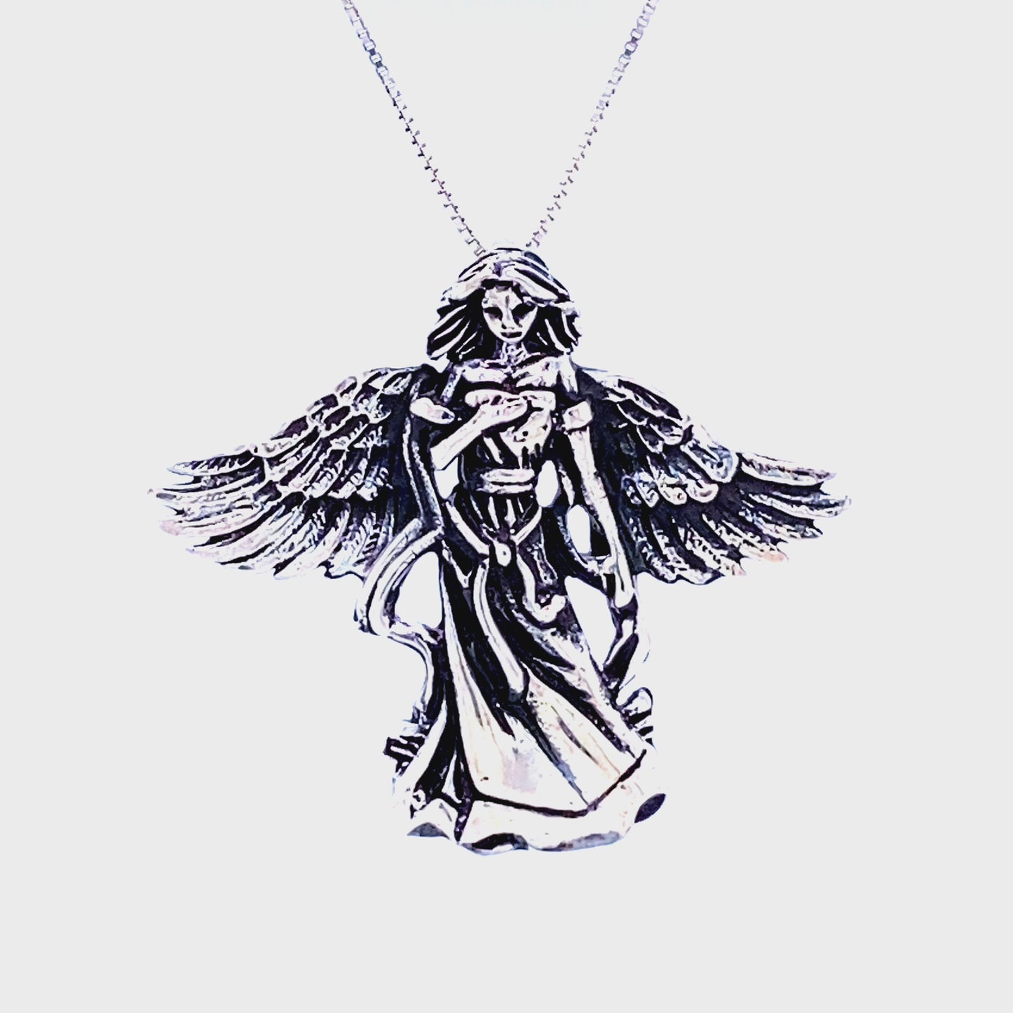 
                  
                    Load and play video in Gallery viewer, Flowing Angel Pendant With Hand Over Heart
                  
                