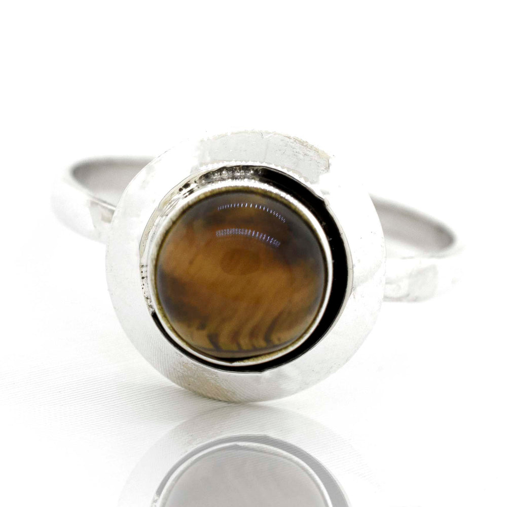 
                  
                    A Round Gemstone Ring With Oxidized Outline adorned with a tiger eye gemstone by Super Silver.
                  
                