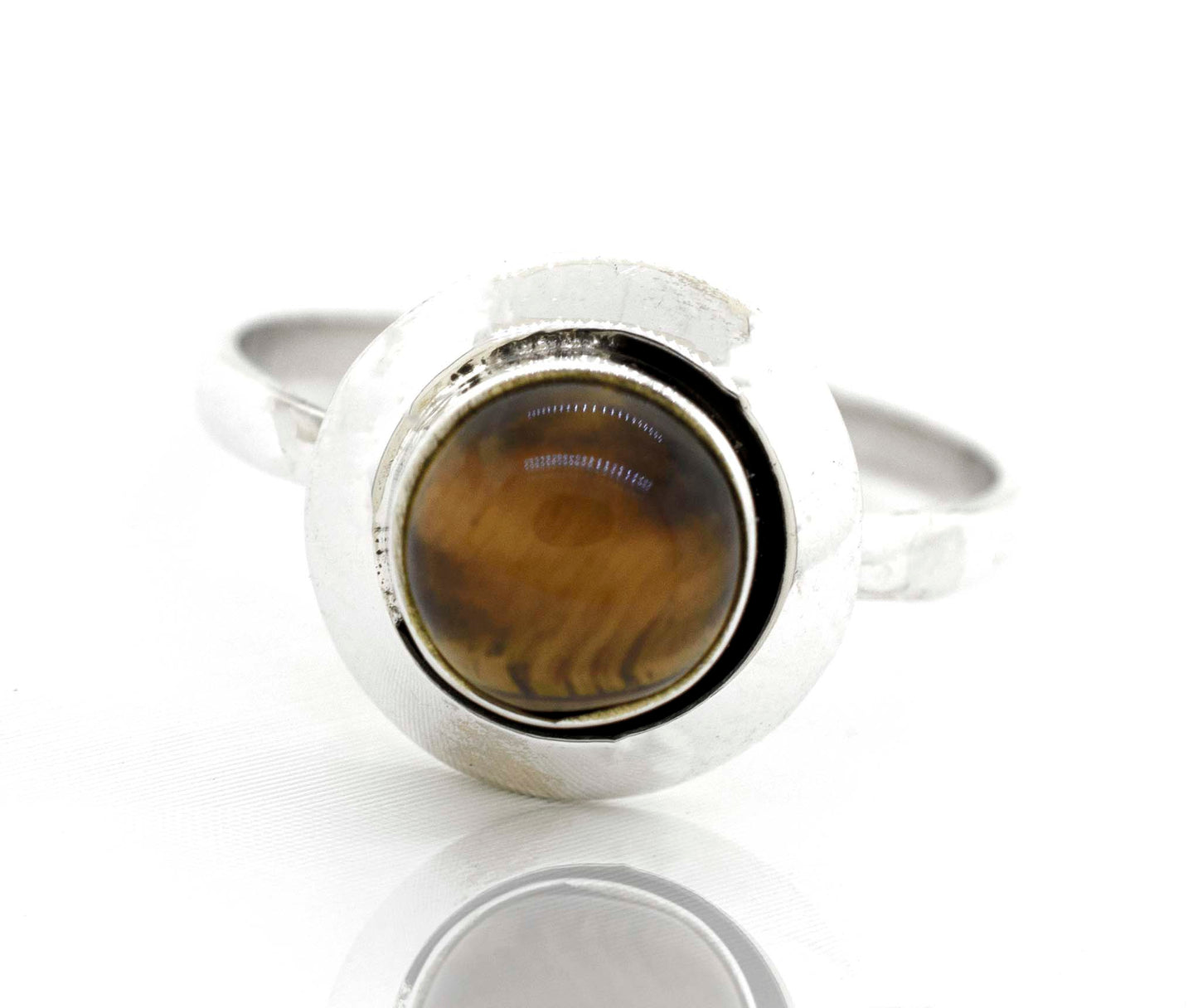 
                  
                    A Round Gemstone Ring With Oxidized Outline adorned with a tiger eye gemstone by Super Silver.
                  
                
