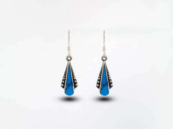 A pair of Super Silver Blue Turquoise Teardrop Shaped Bali Inspired Earrings, set against a crisp white background.