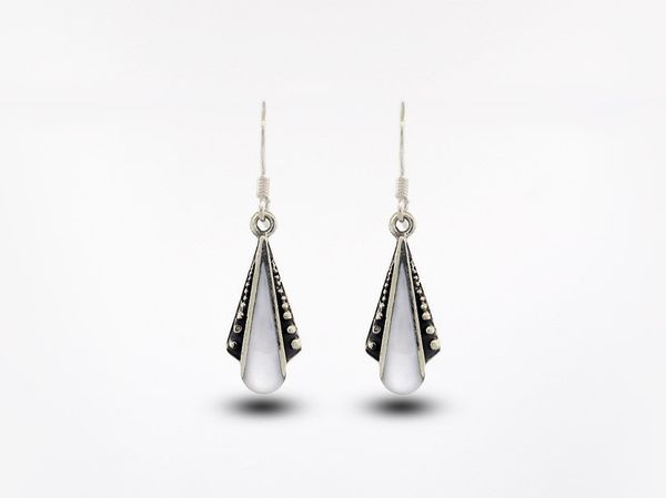 A pair of Super Silver Mother of Pearl Teardrop Shaped Bali Inspired Earrings on a white background.