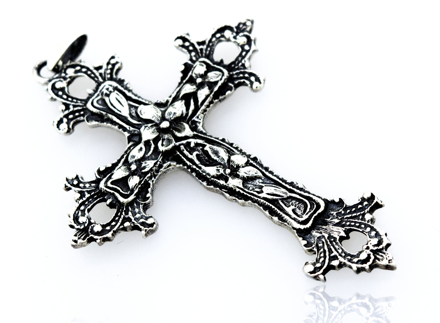 A vintage style, Medieval Floral Cross Pendant, serving as a statement centerpiece on a white surface.