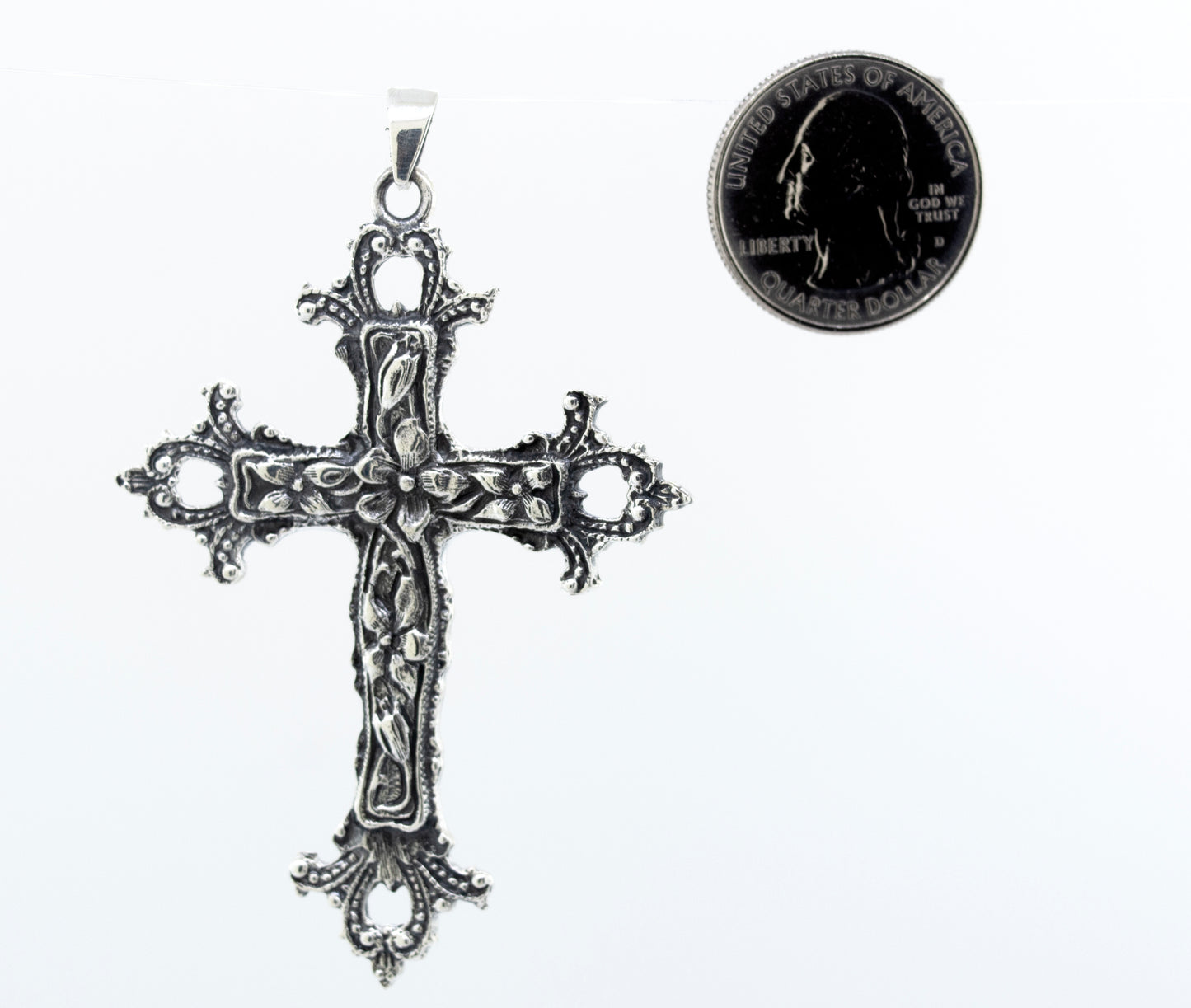 
                  
                    A vintage-style Super Silver Medieval Floral Cross Pendant with a coin, serving as a statement centerpiece.
                  
                