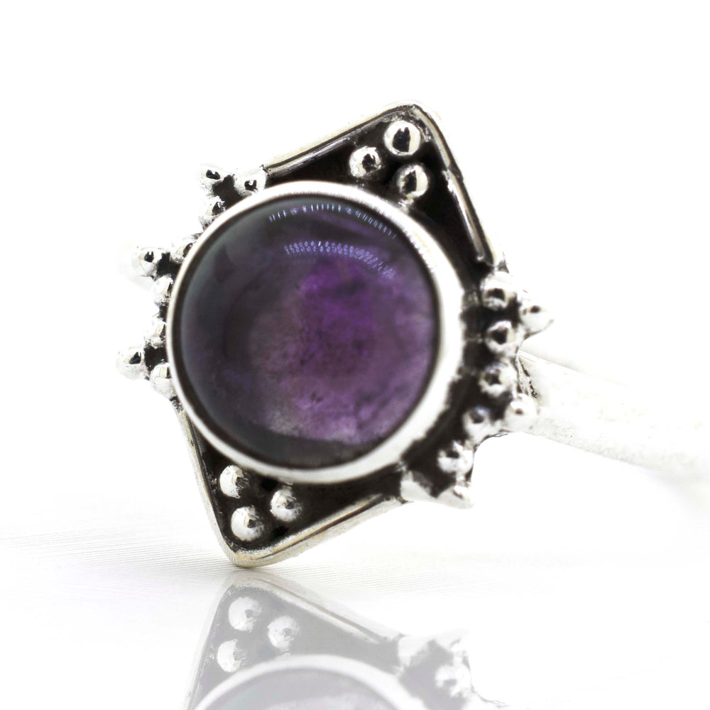 
                  
                    Round Gemstone Ring With Oxidized Diamond Shape Pattern in sterling silver.
                  
                