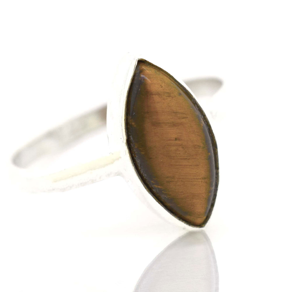 
                  
                    A Super Silver Simple Marquise Shaped Gemstone Ring on a white surface.
                  
                