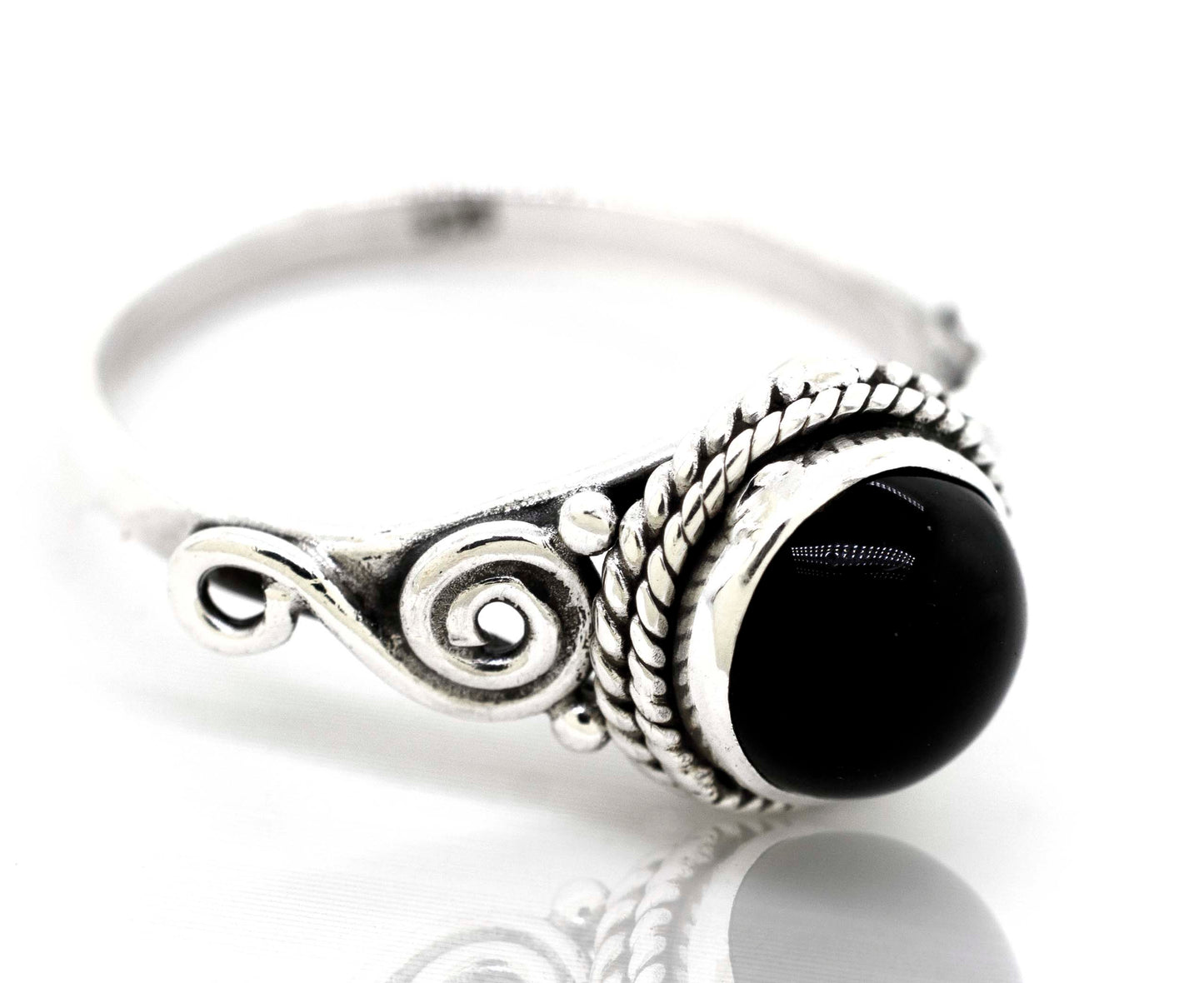 
                  
                    A Gemstone Circle Ring With Rope Border And Swirl Design made by Super Silver, exuding a bohemian vibe.
                  
                