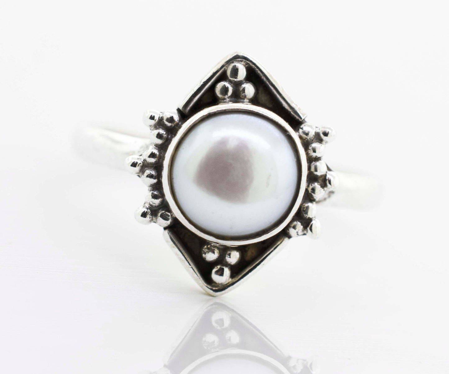 
                  
                    A Super Silver round gemstone ring with oxidized diamond shape pattern in the center.
                  
                