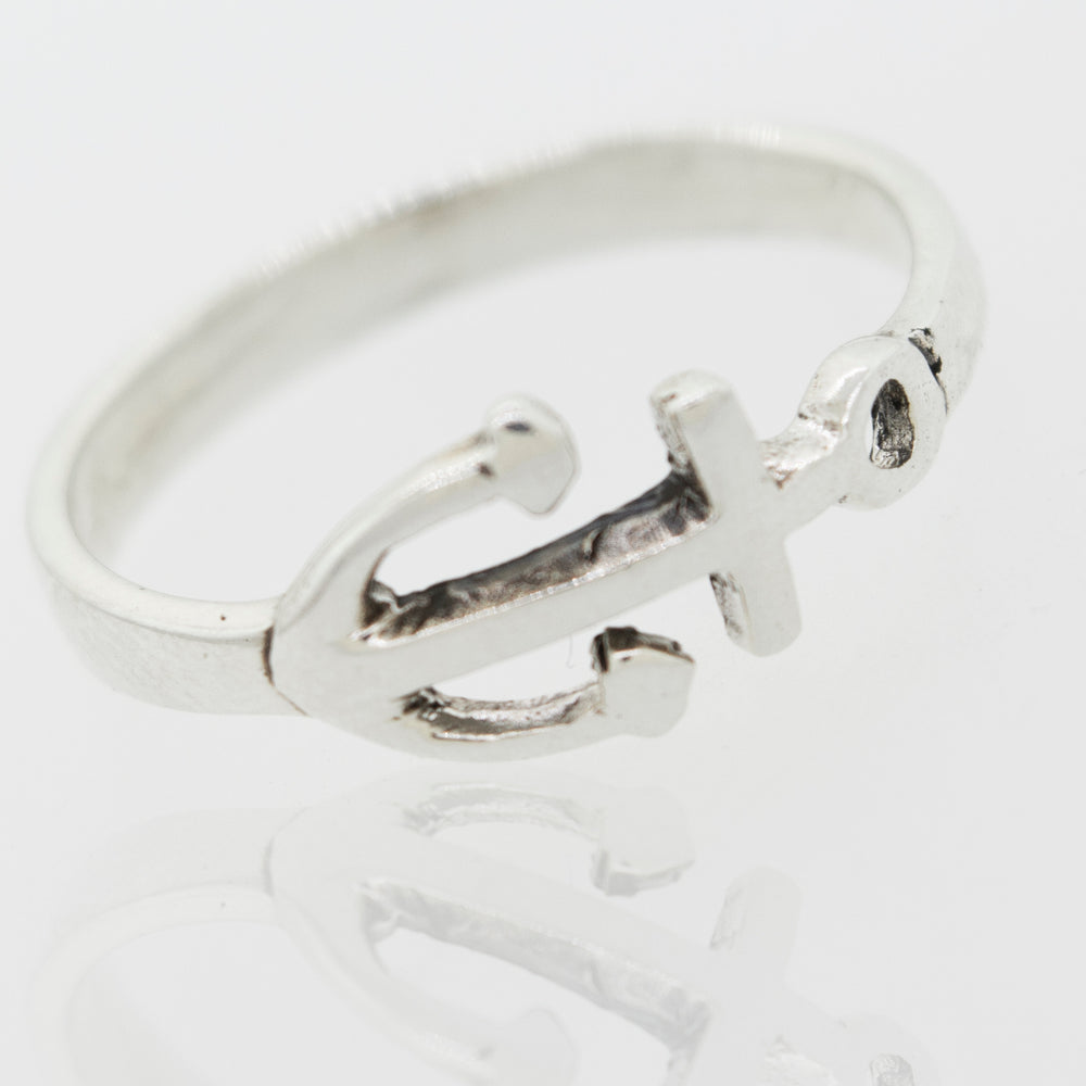 
                  
                    A Delicate Anchor Ring adorned with a horizontal anchor, perfect for ocean lovers, from Super Silver.
                  
                