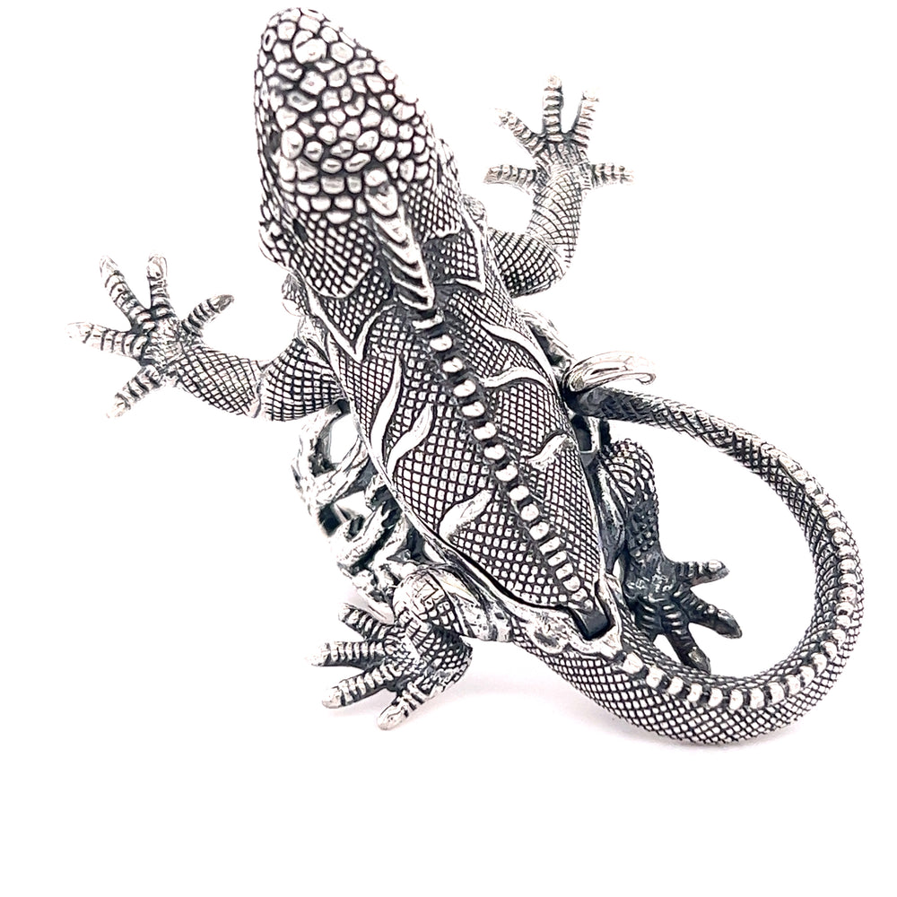 
                  
                    A handcrafted Super Silver Iguana Pendant on a white background.
                  
                