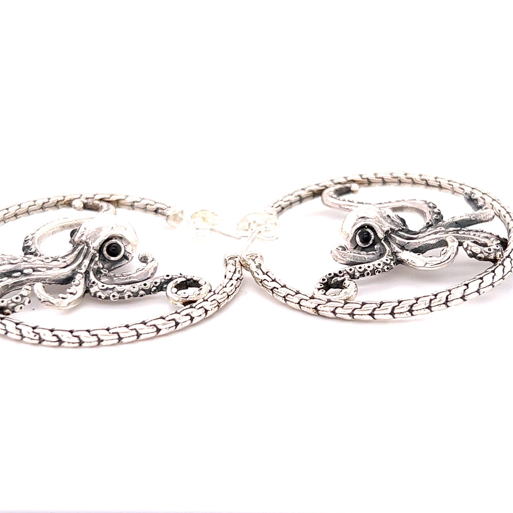 A pair of Super Silver Designer Handcrafted Octopus Earrings on a white background.