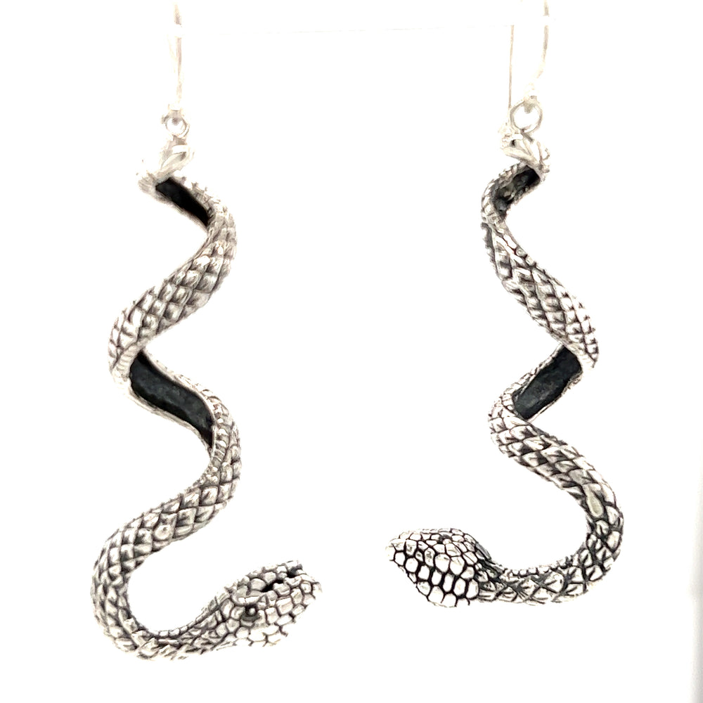 Handcrafted Super Silver Enchanting Twist Snake Earrings on a white background.