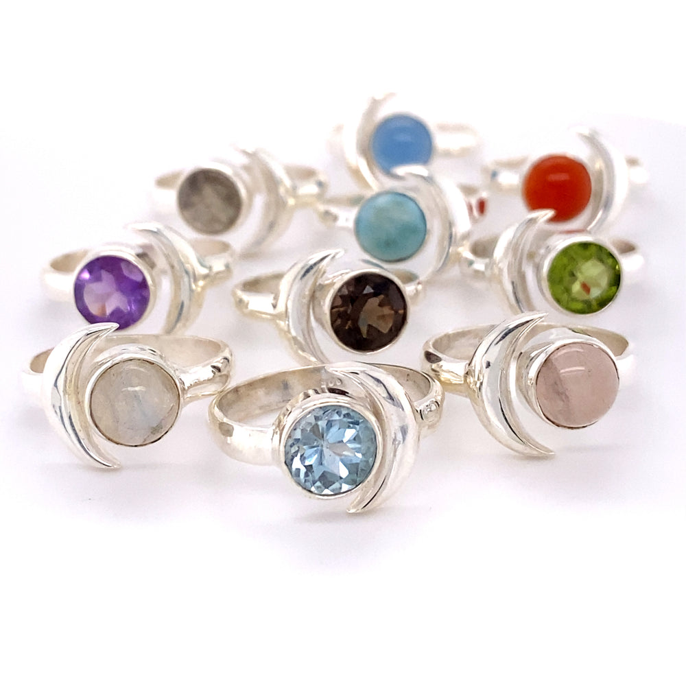 A group of Crescent Moon Rings with Natural Gemstones.