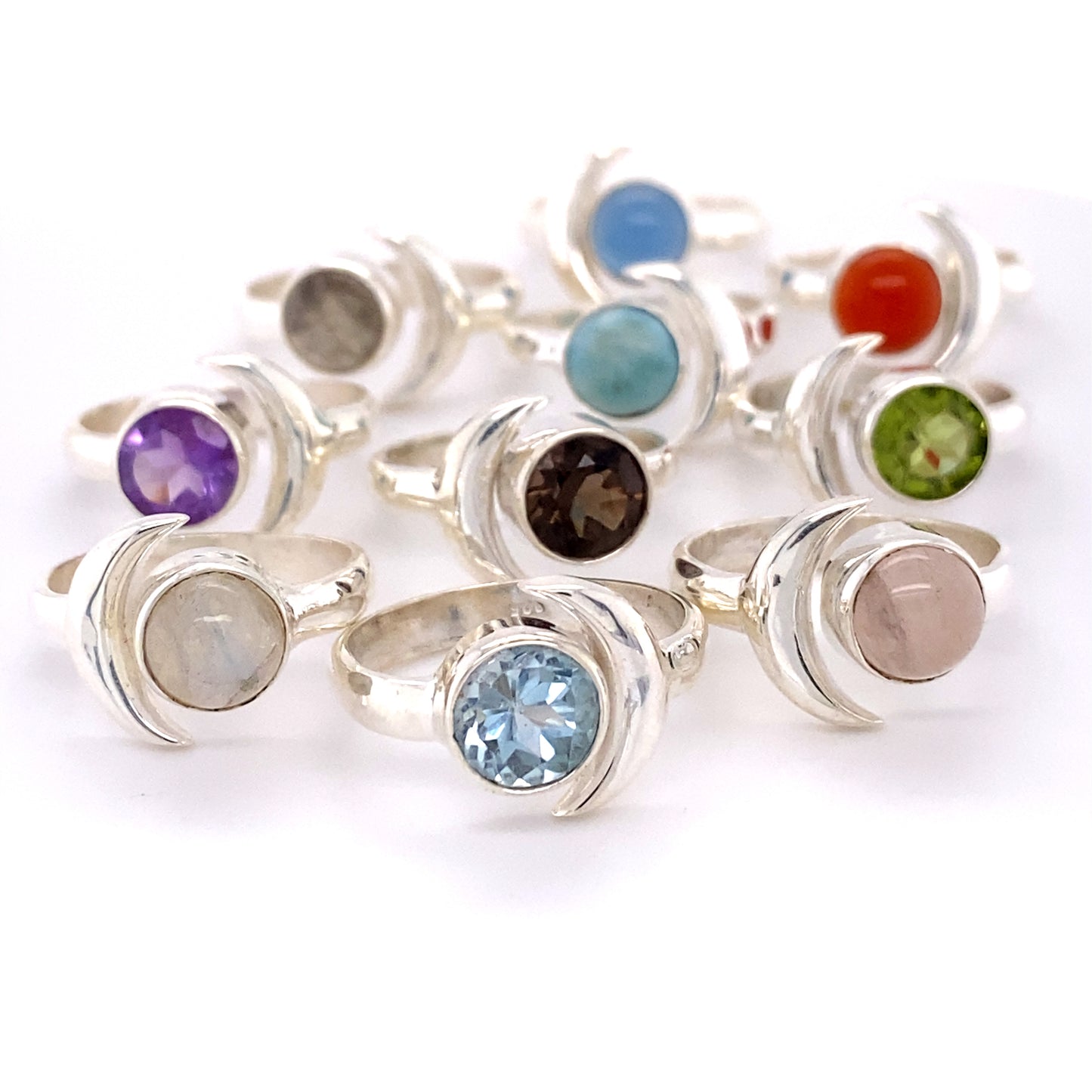 A group of Crescent Moon Rings with Natural Gemstones.