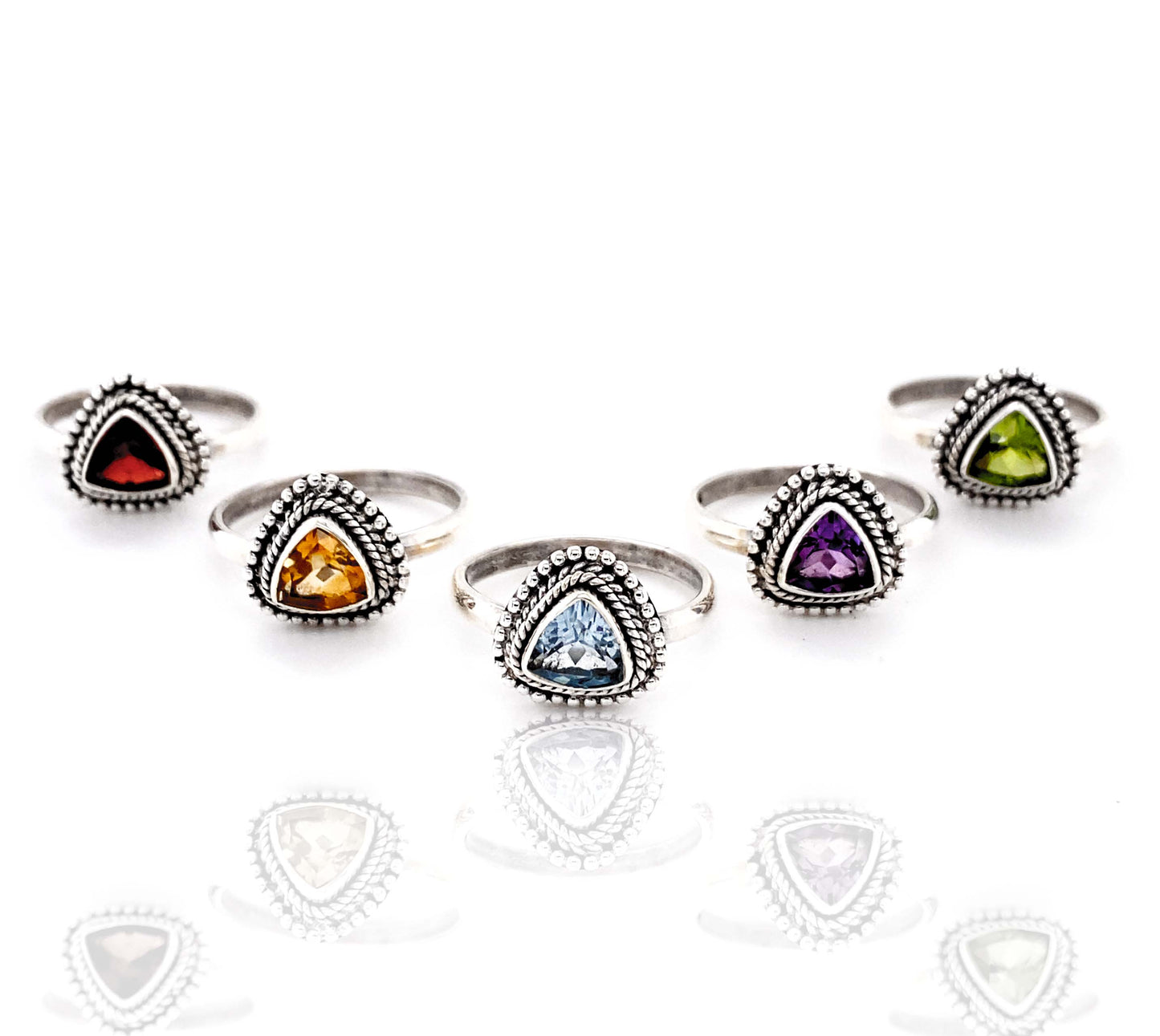 A set of Triangle Gemstone Rings with Rope Border.