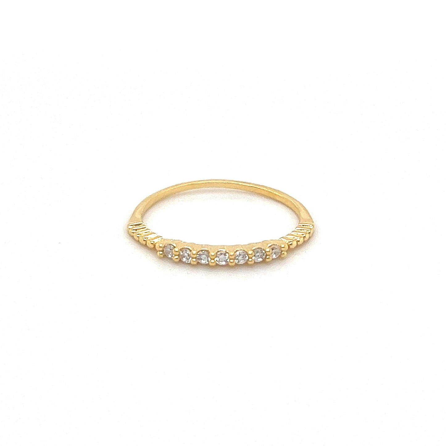 
                  
                    A yellow gold delicate Cubic Zirconia stackable ring with three elegant diamonds.
                  
                