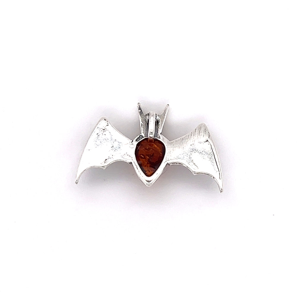 
                  
                    A Haunting Amber Bat Pendant from Super Silver adorned with a stunning Baltic amber stone in deep cognac colors.
                  
                