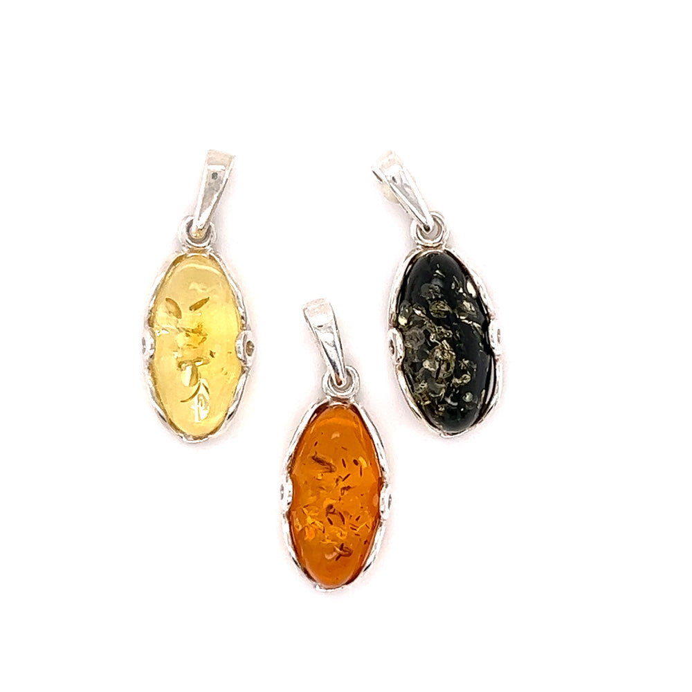 Three Super Silver Charming Oval Amber pendants on a white background.