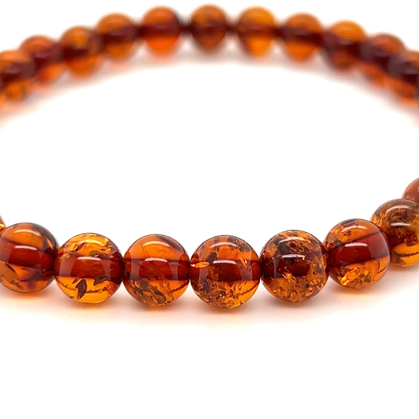 Boho-Chic Amber Bead Bracelet from Super Silver, perfect for adding a touch of elegance to any outfit. Handcrafted with genuine Baltic amber beads, this bracelet is not only stylish but also believed to possess healing properties.