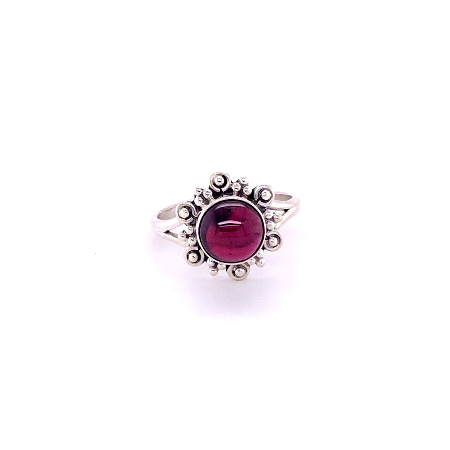 
                  
                    A bohemian style Super Silver Beautiful Round Flower Ring with Natural Gemstones featuring a cabochon garnet stone in sterling silver.
                  
                