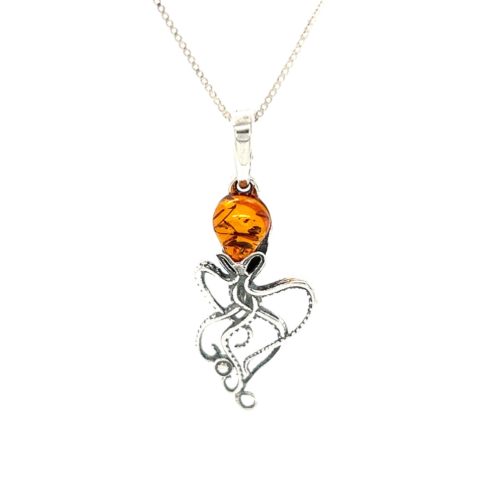 A stunning Whimsical Amber Octopus Pendant adorned with Baltic amber beads, elegantly hanging from a Super Silver sterling silver chain.
