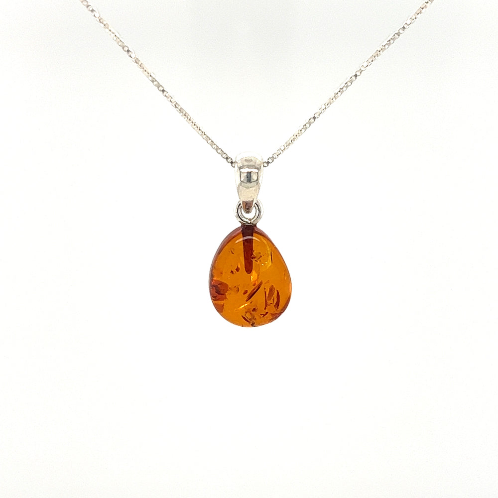 
                  
                    Super Silver's Teardrop Amber Pendant, with a minimalist look, in sterling silver.
                  
                