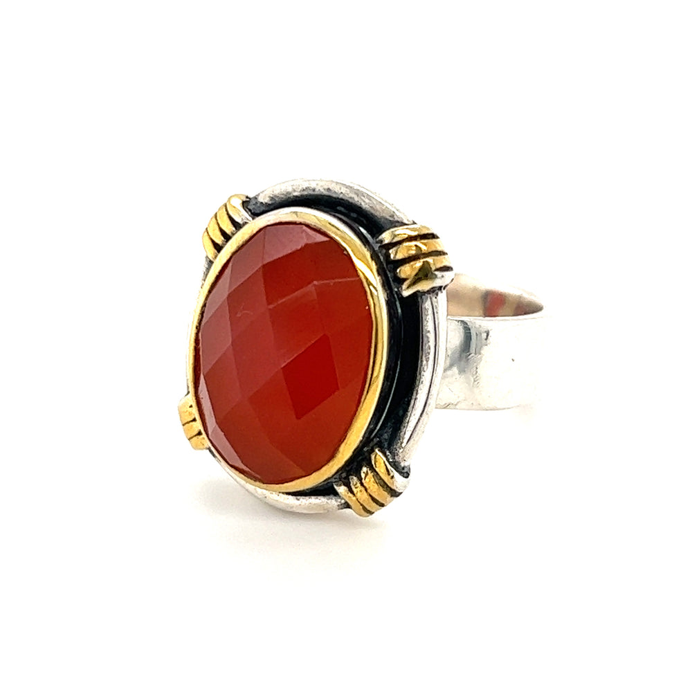 A Courtly Faceted Carnelian Ring from Super Silver, an ancient Egyptian-inspired ring with gold-plated accents.